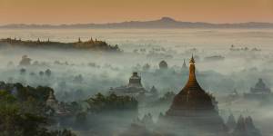 The temples and pagodas of misty Mrauk U,an archeological site in western Burma. Scenes of temples among misty hills are among the sights that had drawn tourists to Myanmar,largely uncharted since colonisation ended. 