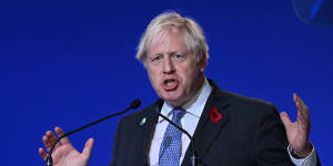 Seeking climate success through side deals:British Prime Minister Boris Johnson at COP26.