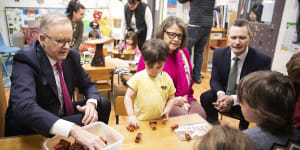 Prime Minister Anthony Albanese (left) and Education Minister Jason Clare (right) at a childcare centre last year. Any changes to childcare will put a strain on the federal budget.