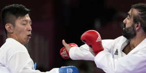 Tsuneari Yahiro of Australia,left,and Rafael Aghayev of Azerbaijan compete in the men’s karate kumite on Friday.