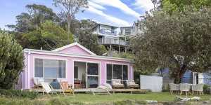 The landmark pink cottage was sold by stockbroker Tim Eustace and Salvatore Panui less than two years after they bought it.