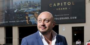 Larry Kestelman in 2016 in front of the hoarding for his Capitol Grand project in South Yarra.
