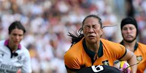 Siokapesi Palu of Australia is tackled by Morwenna Talling of England during the Women’s Rugby World Cup 2025 Pool A match between England and Australia at Brighton&Hove Albion Stadium.