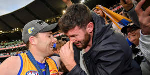 Brothers in arms:An emotional Mitch McGovern with brother Jeremy,after the latter was part of the Eagles’ 2018 premiership.