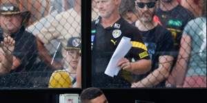 Dion Prestia of the Tigers looks on from the bench after leaving the field with a pectoral injury.