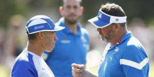 Kangaroos head coach Alastair Clarkson (left) chats with Kangaroos assistant coach Brett Ratten in February.