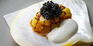 Scallop with oyster emulsion,marigold and caviar.