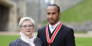 Sir Lewis Hamilton with his mother Carmen Lockhart (nee Larbalestier) after he was made a Knight Bachelor by the Prince of Wales during an investiture ceremony at Windsor Castle in 2021.