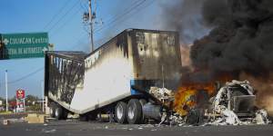 A truck burns on a street in Culiacan,Sinaloa state,after the arrest of Ovidio Guzman,son of jailed drug lord El Chapo.
