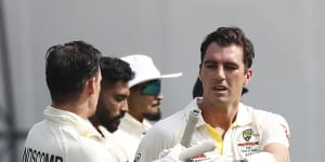 Pat Cummins batting with Peter Handscomb during the Delhi Test.