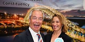 Nigel Farage and Sarah Pochin of the Reform Party celebrate as the latter is declared the winner of the Runcorn and Helsby byelection.