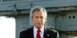 President George W. Bush declaring the end of major combat in Iraq in 2003,but the war dragged on for many years after that.