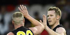 Jack Riewoldt is congratulated after kicking a goal in the Tigers’ win.