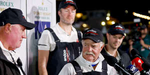 John Winning snr with his son John jnr (background) after Andoo Comanche took 2022 Sydney to Hobart line honours.