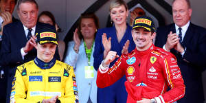 Race winner Charles Leclerc (right) and the second-placed Oscar Piastri celebrate on the famed Monaco podium.