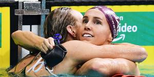 Australian swimmers Madison Wilson and Emma McKeon embrace after a race during last week’s Olympic trials.