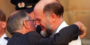 PM John Howard comforts the chief surgeon Dr Bryan Walpole after the State Service for the Port Arthur Victims at The Cathedral Church of Saint David,Hobart on May 1,1996.