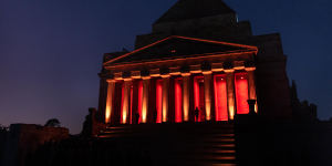 The catafalque party is illuminated at the Shrine of Remembrance during the Anzac Day dawn service.