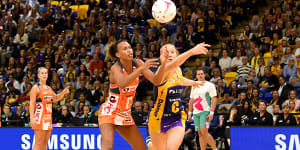 Maddy McAuliffe (right) in action for Sunshine Coast Lightning,against the Giants’ Serena Guthrie.