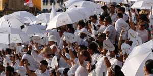 People wait for the start of the peace ceremony in Cartagena,Colombia on Monday.