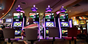 A patron playing the poker machines at rugby league club in Sydney.