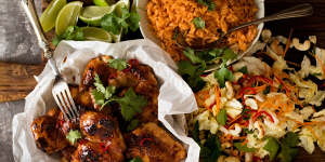Vietnamese chicken served with red rice and coleslaw.