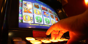 The NSW government is committed to a gambling card to limit gambling harm.