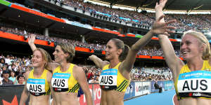 Australian relay runners celebrate their bronze medal at the 2006 games in Melbourne.