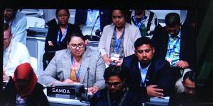 Anne Rasmussen (left),Samoa’s lead negotiator,speaks during a plenary session at COP28.