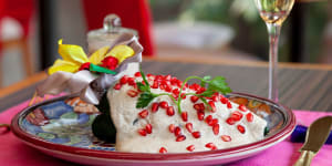 Chiles en nogada,a traditional festive dish,served at Azul's three restaurants in Mexico City,Mexico. The dish consists of poblano peppers,stuffed with fruits and meats,covered in walnut cream sauce and pomegranate seeds. It is eaten in Mexico between August and early September only. 