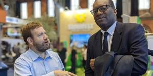 US pollster Frank Luntz speaks to British cabinet minister Kwasi Kwarteng at the Conservative Party Conference in Manchester last year.