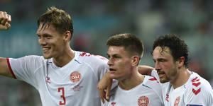 Denmark’s players celebrate their win. 