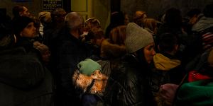 Crowds inside Lviv railway station queue to catch the train to Poland.