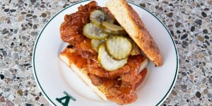 Fried chicken sandwich with deep-fried meat,hot honey butter and crinkle-cut pickles.