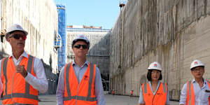 Transport Minister John Graham,left,Premier Chris Minns,Deputy Premier Prue Carr and Strathfield MP Jason Yat-Sen Li tour the Burwood North station site.