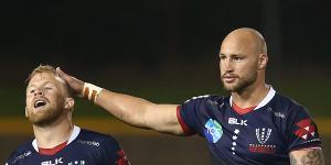 Andrew Deegan of the Rebels and Bill Meakes of the Rebels celebrate victory during the round 6 Super Rugby AU match between the Rebels and Brumbies at Leichhardt Oval on August 07,2020 in Sydney,Australia.
