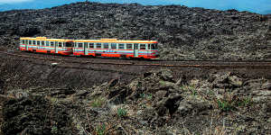 The Ferrovia Circumetnea riding its rocky landscape.