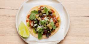Pork al pastor taco,featuring pork off the spit and pineapple salsa.