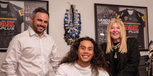 Chiefs general manager Michael Chammas,Tigers captain Jarome Luai and Chiefs chief executive Lorna McPherson after Luai signs with the PNG Chiefs.