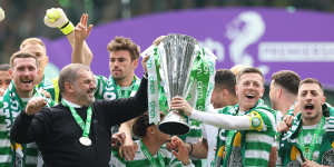 Ange Postecoglou lifts the Scottish Premiership trophy with Celtic last season.