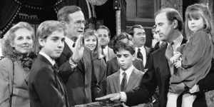 Beau Biden (foreground) and his brother Hunter hold the family Bible as their father Joe re-enacts his swearing-in as US senator for Delaware in January 1985 with then US vice-president George Bush snr.
