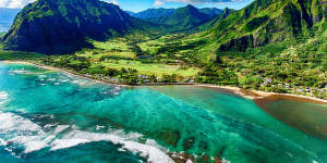 The beautiful and unique landscape of coastal Oahu,Hawaii and the Kualoa Ranch where Jurassic Park was filmed as shot from an altitude of about 1000 feet over the Pacific Ocean. tra15-rants Photo credit:iStock Reusage permitted for print and online
