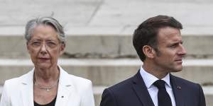 French President Emmanuel Macron and outgoing PM Elisabeth Borne.