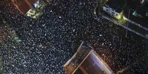 Tens of thousands of Israelis protest in Tel Aviv on Saturday against plans by Prime Minister Benjamin Netanyahu’s new government to overhaul the judicial system.