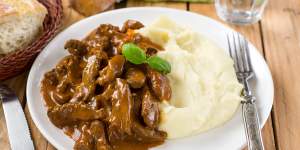 Beef stroganoff - a dish said to have been invented in St Petersburg - in tomato gravy with sour cream served with mashed potatoes 