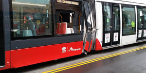 Tram badly damaged after collision with truck in George Street