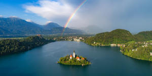 Somewhere and a rainbow – Lake Bled,the island and the alps.