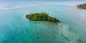 An aerial view of Muri Lagoon at sunrise on Rarotonga in the Cook Islands.