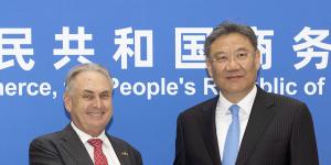 Trade Minister Don Farrell and Chinese Commerce Minister Wang Wentao in Beijing on Friday.