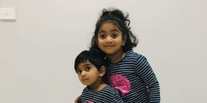 Tharunicaa,left,is pictured with her four-year-old sister Kopika.